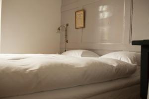 Boutique-Hotel Guesthouse Le Locle客房内的一张或多张床位
