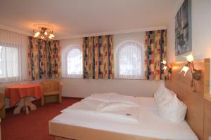 Cama o camas de una habitación en Hotel Garni Pradella