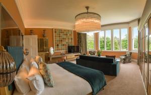 a bedroom with a large bed and a living room at Homewood Hotel & Spa - Small Luxury Hotels of the World in Bath