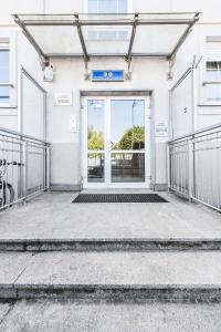 an entrance to a building with a door at Sea Flats - Studio in Sopot