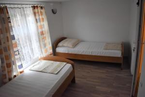 Apartments Vrkic tesisinde bir odada yatak veya yataklar