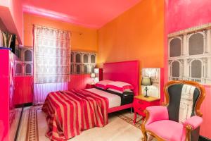 Una cama o camas en una habitación de Appartamenti MarcoAurelio49