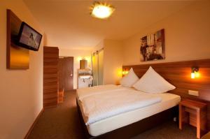 
Ein Bett oder Betten in einem Zimmer der Unterkunft Astay Hotel
