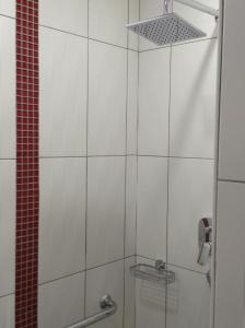 a bathroom with a shower with a glass door at Chambre d'hôte du HOUSSAY à VALENNES 72320 in Valennes +13 photos