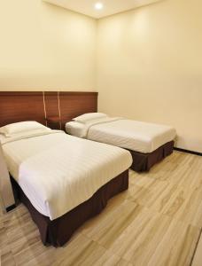 Cama o camas de una habitación en Grand Kebonsari Guesthouse