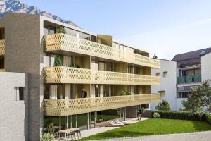 an apartment building with balconies on the side of it at Appartement Baumgärtner in Naturno