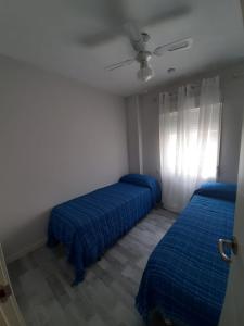 Łóżko lub łóżka w pokoju w obiekcie Casa aragon