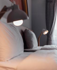 Letto o letti in una camera di Clay Hotel Udonthani
