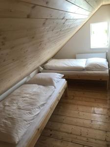 Postel nebo postele na pokoji v ubytování Apartmány Michaela
