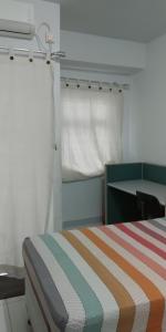 Un ou plusieurs lits dans un hébergement de l'établissement Apartment Kota Ayodhya - Christine