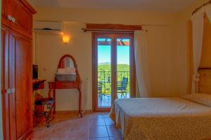 Posteľ alebo postele v izbe v ubytovaní Corfu Sokraki Villas