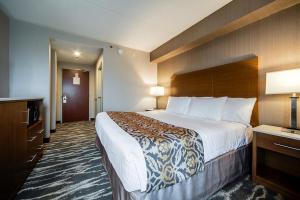 Voodi või voodid majutusasutuse Monte Carlo Inn Brampton toas