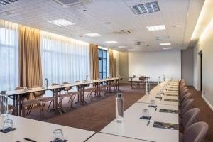 a conference room with tables and chairs in it at Domaine De Saint Clair Spa & Golf in Saint-Clair +29 photos