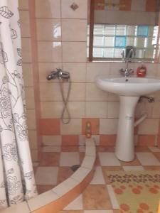 a bathroom with a sink and a shower at Ground Floor Studio Galini in Rethymno +32 photos