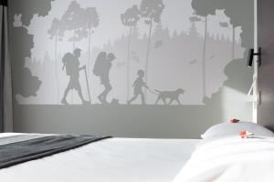 Postel nebo postele na pokoji v ubytování Le Merceny Motel