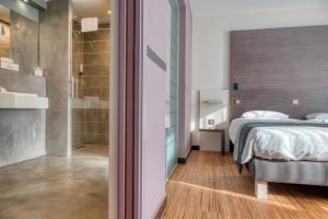 Postel nebo postele na pokoji v ubytování Le Merceny Motel