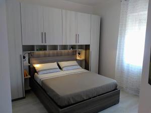 Giường trong phòng chung tại Tra cielo e mare