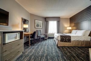 Voodi või voodid majutusasutuse Monte Carlo Inn Brampton toas