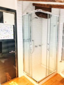 a shower with a glass door in a bathroom at Casa Legami Charme&Relax in Bergamo +19 photos