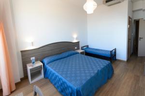 Postel nebo postele na pokoji v ubytování Hotel Turistica