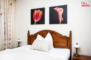 Postel nebo postele na pokoji v ubytování Hotel Zodiak
