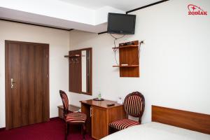 TV a/nebo společenská místnost v ubytování Hotel Zodiak
