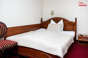 Postel nebo postele na pokoji v ubytování Hotel Zodiak