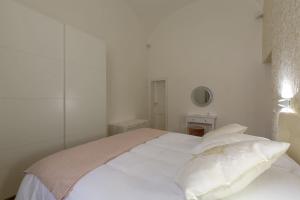 Posteľ alebo postele v izbe v ubytovaní FLORENCE FIORINO APARTMENT