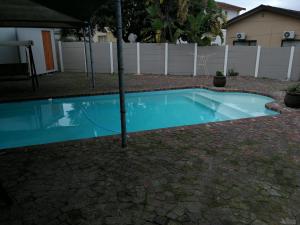 a swimming pool with a tree in the middle at Posto Al Sole - IL Bacio in Bellville