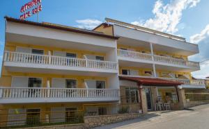 a building with balconies on the side of it at ATHINA MARE-SOLE in Kallithea Halkidikis