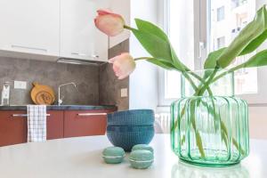A kitchen or kitchenette at JOIVY Bright Apartment for 4 next to City Life