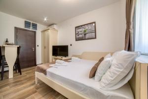 a bedroom with a large bed in a room at Casa Nuova in Kotor