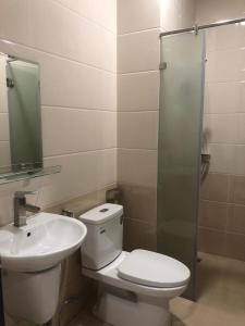 a bathroom with a toilet and a sink at 319 Liên Phường, Q9 in Ho Chi Minh City +3 photos