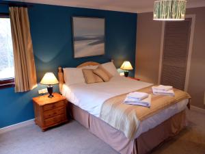 Llit o llits en una habitació de Oak Tree Lodge