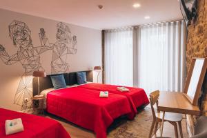 Ένα ή περισσότερα κρεβάτια σε δωμάτιο στο In Barcelos Hostel & Guest House