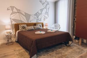 Ένα ή περισσότερα κρεβάτια σε δωμάτιο στο In Barcelos Hostel & Guest House