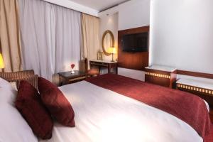 Postel nebo postele na pokoji v ubytování Hotel Flamenco Cairo