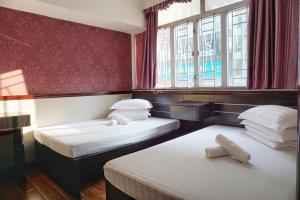 Rúm í herbergi á Hang Ho Hostel