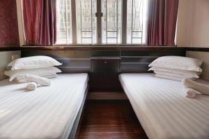 Rúm í herbergi á Hang Ho Hostel