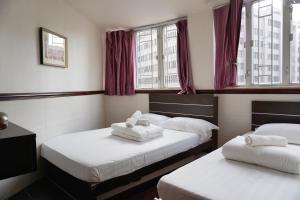 Rúm í herbergi á Hang Ho Hostel
