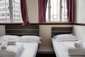 Rúm í herbergi á Hang Ho Hostel