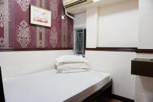Rúm í herbergi á Hang Ho Hostel