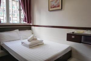 Rúm í herbergi á Hang Ho Hostel