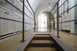 a large room with a hallway with a wooden floor at Rashbi 54 in Safed