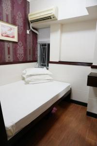Rúm í herbergi á Hang Ho Hostel