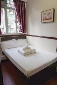 Rúm í herbergi á Hang Ho Hostel