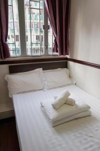 Rúm í herbergi á Hang Ho Hostel
