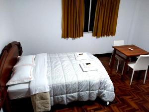 Giường trong phòng chung tại Santa Victoria House +40 ảnh