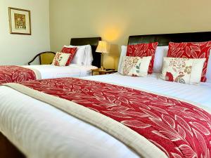 Ліжко або ліжка в номері Kingfisher Lodge