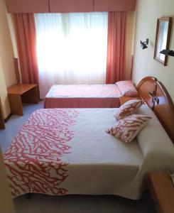 Posteľ alebo postele v izbe v ubytovaní Hotel Paraíso Del Marisco